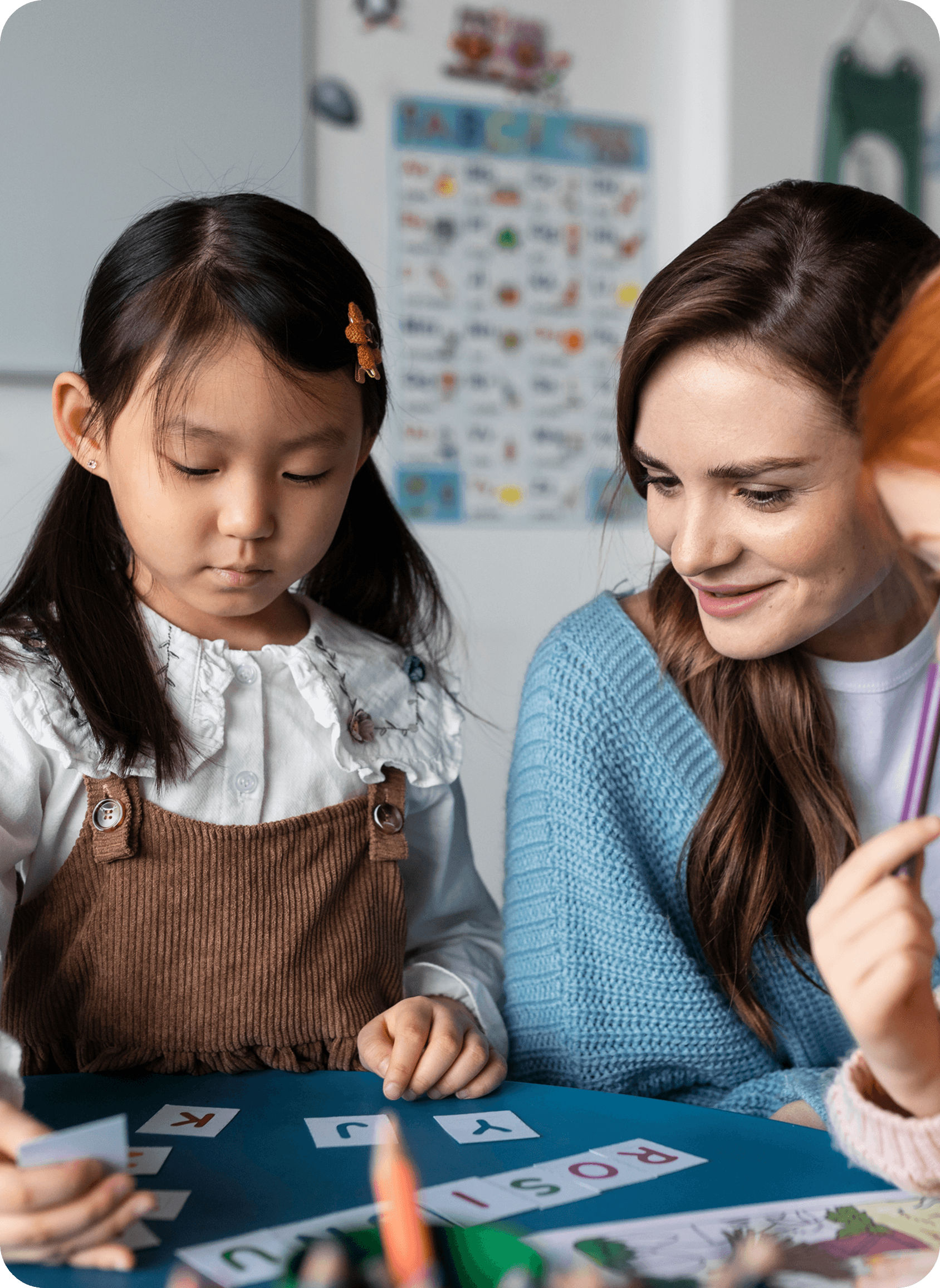 Teacher helping student with learning materials